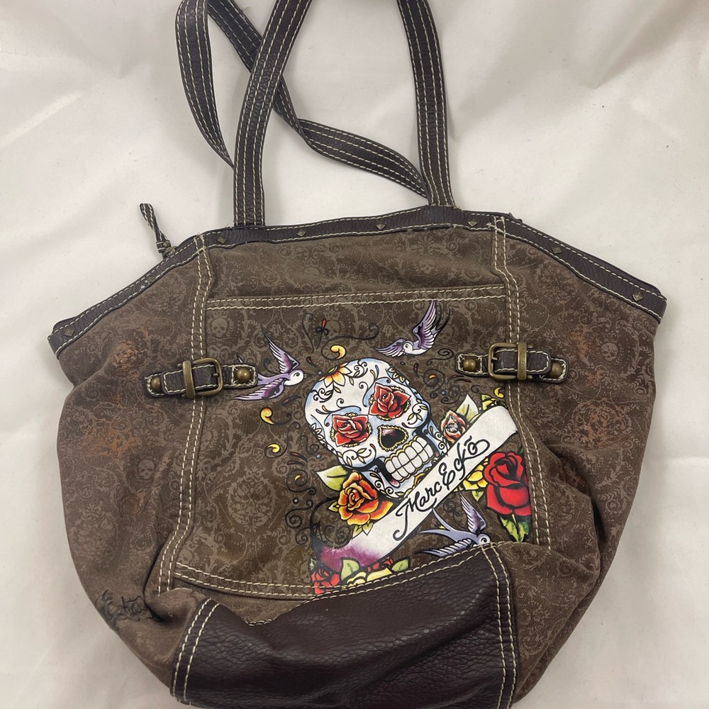 Marc Ecko brown canvas travel bag with cool skeleton design on the front.